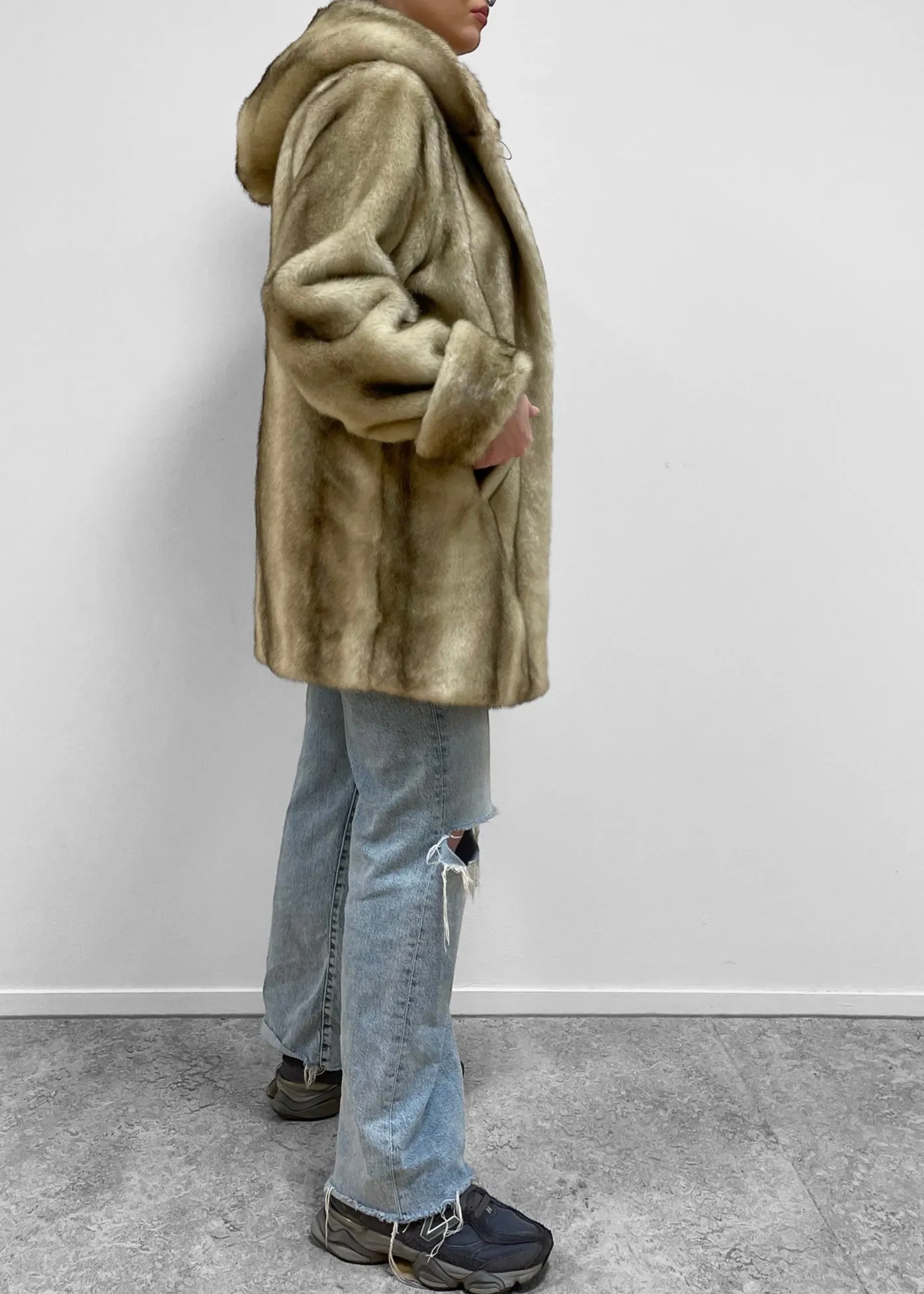 Certainly! To optimize the e-commerce product title, we should include key descriptors that highlight important features, appeal to potential buyers, and improve searchability. Heres an optimized version:

Dennis Basso Luxurious Mid-Length Faux Fur Coat for Women - Chic and Elegant Design