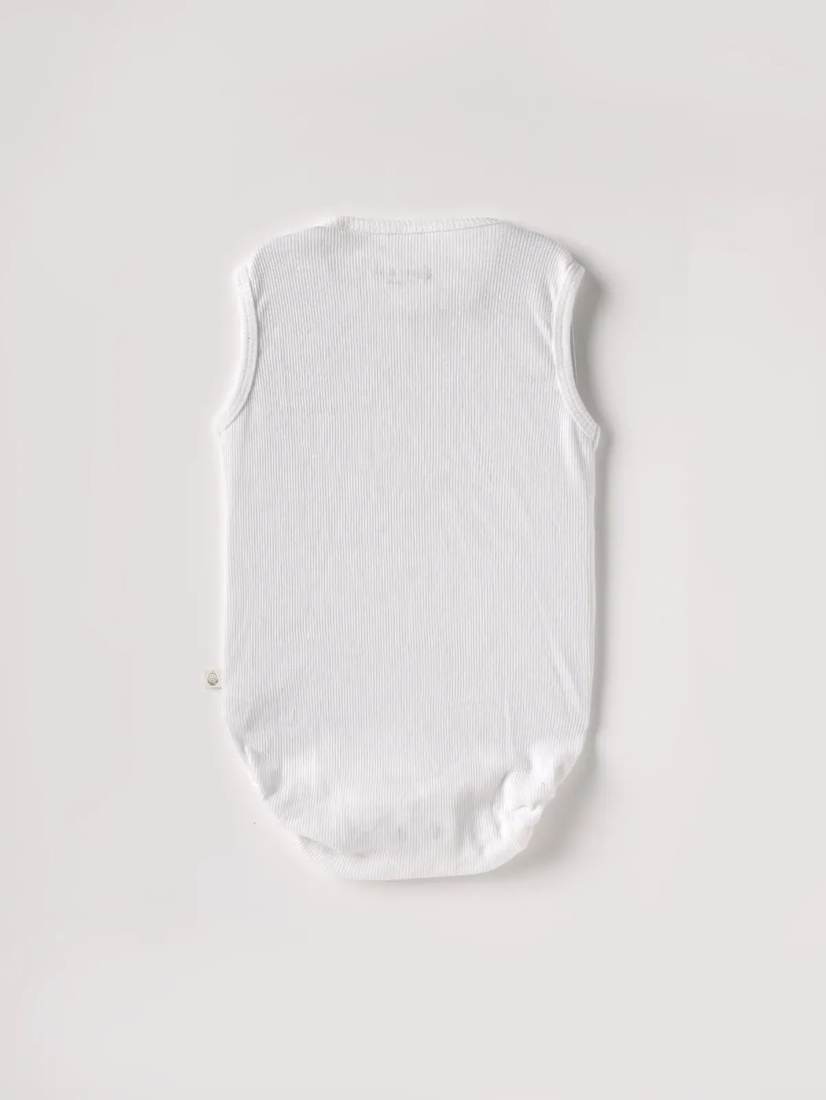 Sleeveless pure white bodysuit for baby